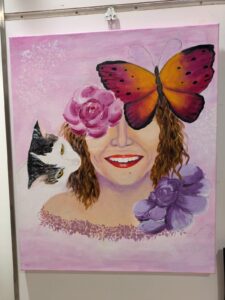 Il quadro rappresenta varie parti di me:Il mio sorriso, elemento esplicito e visibile a tutti.
Il mio gatto Artù (soggetto ricorrente nei miei quadri).
I fiori che amo da sempre.
La farfalla che rappresenta la leggerezza del ballo, che è una delle mie passioni.